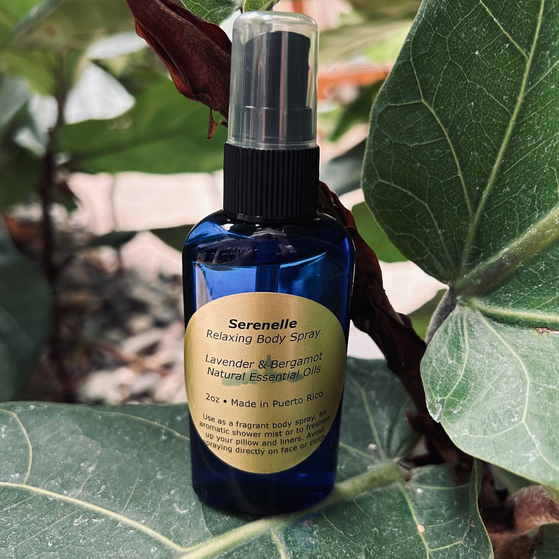 Serenelle Relaxing Body Spray bottle on a leafy background
